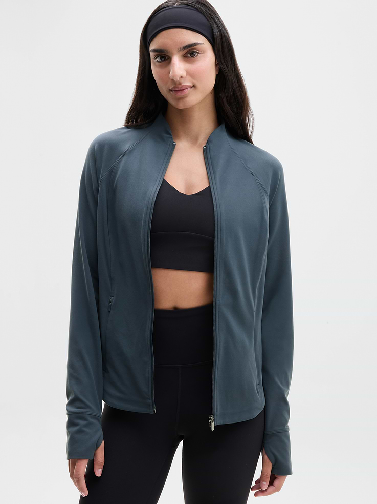 Image 1 of 4, FOR: Layering up to and from your workout, FEEL: Powervita fabric is buttery soft with support that feels like a gentle hug, FAVE: Thumbholes that keep your sleeves in place, Side zip pockets secure your essentials, Product #657490