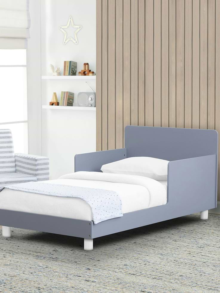 Image 1 of 3, Bring vibrant color and statement-making design to your child’s bedroom with this GapKids by Delta Children Toddler Bed., Well-crafted, this modern toddler bed features a square headboard, two-tone accents and round legs., More than just a good-looking option, this toddler bed is made with two attached guardrails and a low height that makes it easy for kids to get in and out on their own., This product is Greenguard Gold certified to meet stringent chemical emissions standards., Complete your child’s bedroom by mixing, matching, and layering this bed with other pieces from the GapKids by Delta Children Collection., Mattresses not included.