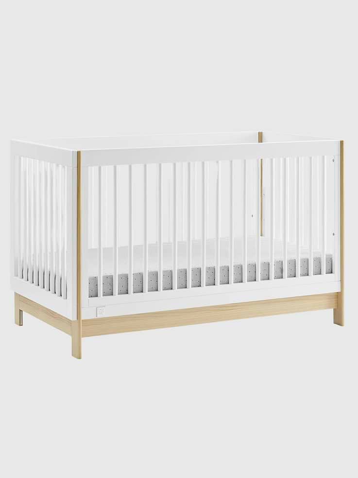 Image 1 of 8, The babyGap Tate 4-in-1 Convertible Crib is a modern crib with natural accents on the base and corner posts., Thoughtfully made to grow with your baby, the crib's adjustable mattress support has three convenient positions that allow you to lower the mattress height as they get older., The Tate Crib grows with your little one, converting from a crib to a cozy toddler bed, daybed and sofa (conversion rails sold separately)., This crib is Greenguard Gold certified to meet stringent chemical emissions standards., Safe for baby, this crib is JPMA certified to meet or exceed all safety standards set by the CPSC & ASTM., This crib uses a standard crib size mattress (sold separately).