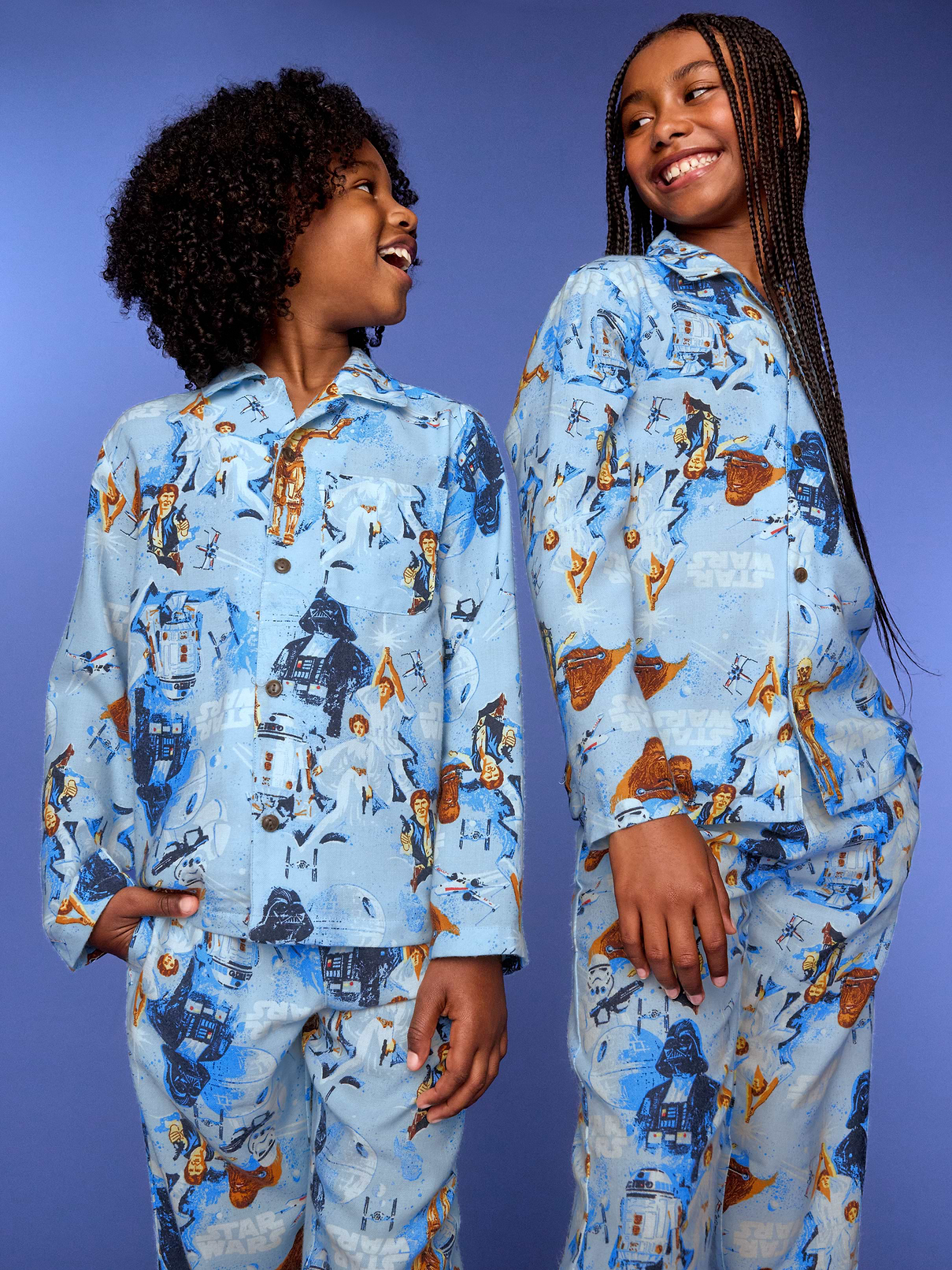 Image 1 of 2, notched collar, long sleeves, patch chest pocket, full button front, matching pajama pants, elasticized waistband, on-seam pockets, © & ™ Lucasfilm, Ltd, Product #906392