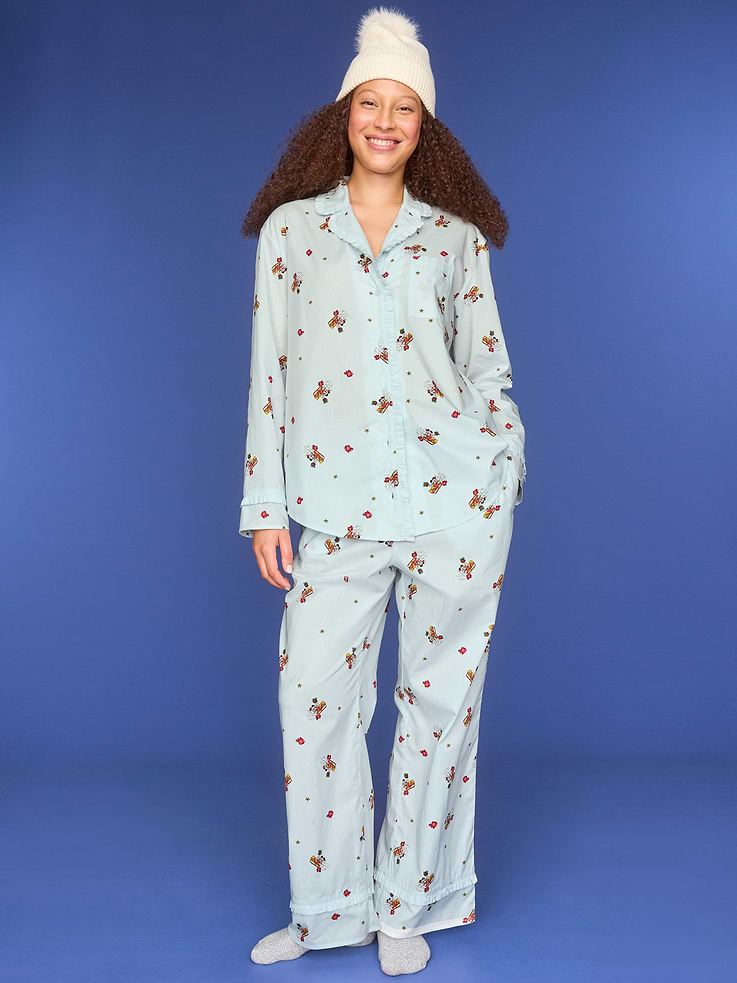 Image 1 of 4, set includes pajama shirt and matching bottoms, spread collar, long sleeves, button front, patch chest pocket, elastic-waist pajama pants, on-seam pockets, ruffle trim, ©Disney, Product #910771