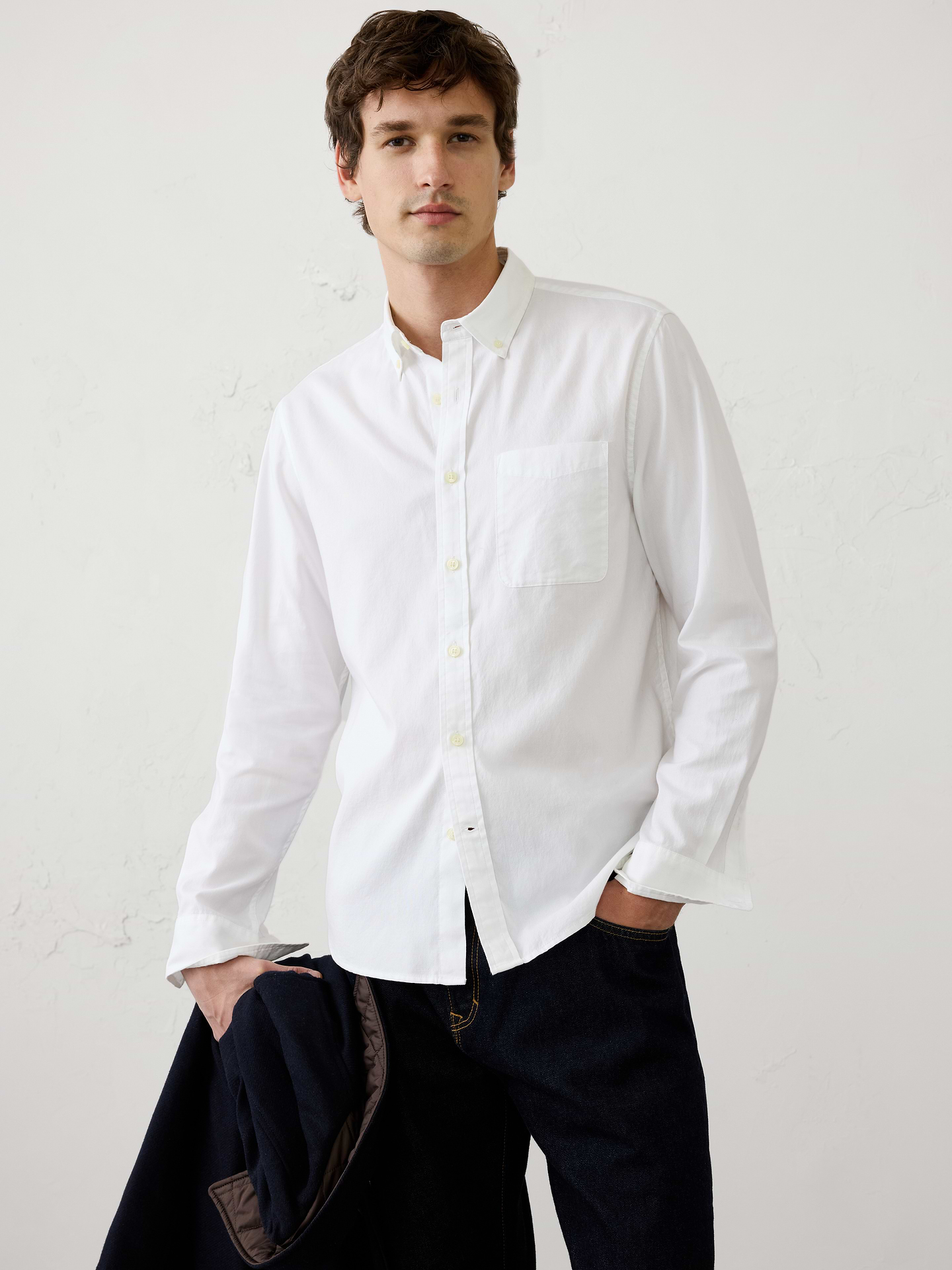 Image 1 of 4, A timeless wardrobe staple, this pinpoint oxford shirt is crafted from 100% cotton for a soft, smooth feel. Designed with a clean finish and classic detailing, it delivers versatile style that transitions effortlessly from dressed‑up moments to casual everyday wear., Button down collar. Long sleeves with adjustable buttoned cuffs., Patch chest pocket., Back yoke with center box pleat., Shirttail hem., Made exclusively for Banana Republic Factory., Product #1175893