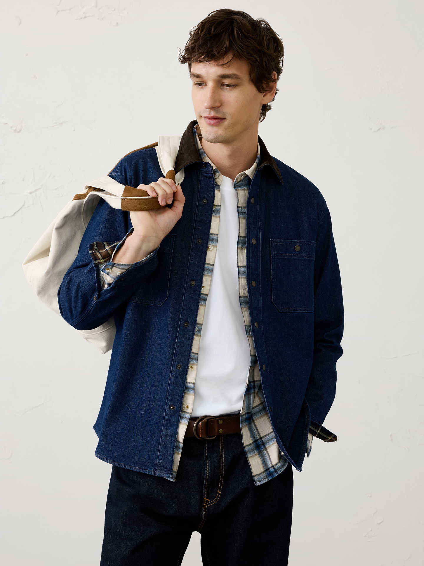 Image 1 of 3, This denim shirt jacket is lined with soft flannel for added warmth and a heritage‑inspired feel. Finished with a classic corduroy collar, it combines rugged utility with timeless style, making it an easy layering piece for cooler days., Stand collar. Long sleeves with buttoned cuffs., Button‑front closure., Chest pockets., Shirttail hem., Made exclusively for Banana Republic Factory., Product #1180396
