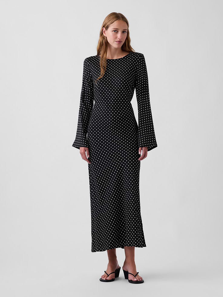 Image 1 of 5, Smooth rayon twill maxi dress., Boatneck with back loop button keyhole closure., Long bell sleeves., Bust darts., Bias cut., Side slit., This product was made in a factory that invests in gender equity and women’s empowerment through RISE. Learn more at gapinc.com/equity ., Product #1184725