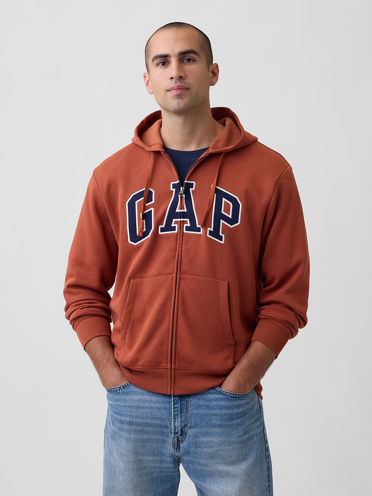Image 1 of 4, This product is made with/contains 23% recycled polyester. Compared to virgin materials, using recycled materials helps reduce resource use and waste., Soft, comfy fleece., Dropped shoulder, long sleeves with banded cuffs., Drawcord ties at hood, zip front., Gap logo at front., Kanga pockets., Banded hem., Product #1179548