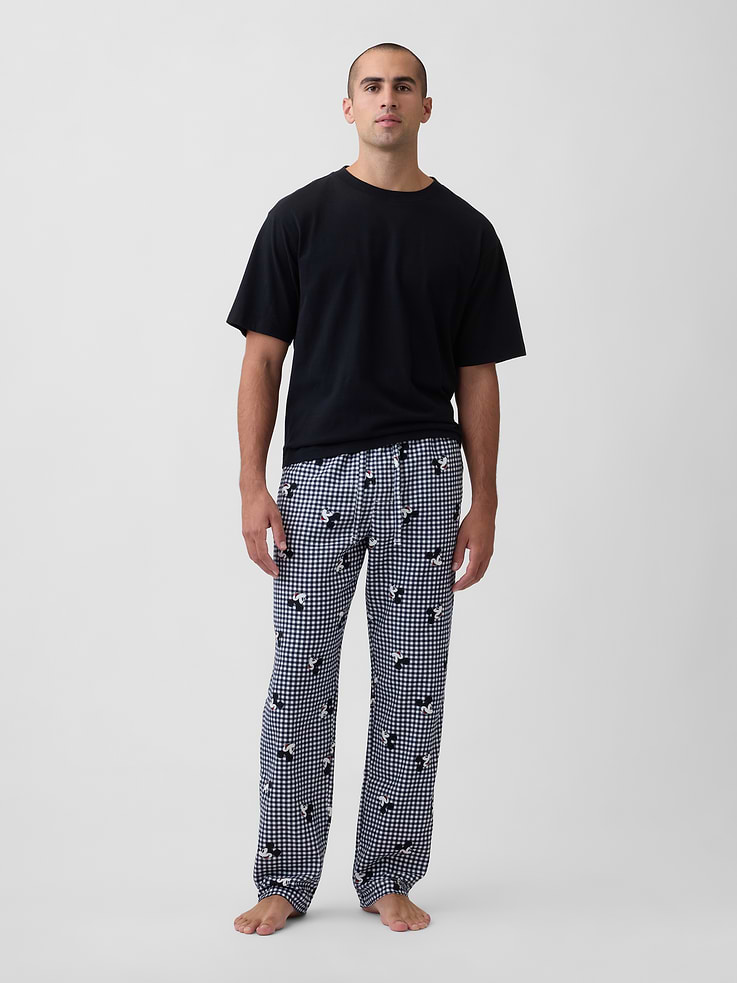 Image 1 of 4, A very special collaboration between Gap and Disney— two timeless, iconic American brands— led us to create a collection that celebrates Mickey Mouse and Minnie Mouse., Smooth flannel sleep pants., Drawcord ties at elasticized waist., On-seam pockets., Allover Mickey Mouse X-Mas print., Shop matching PJs for all., Product #1180427