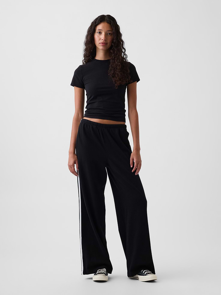 Image 1 of 7, Soft, heavyweight cotton knit track pants. In a relaxed fit., Elasticized waist with inner drawcords., Pieced double side stripes., Side on-seam pockets., Product #1185084