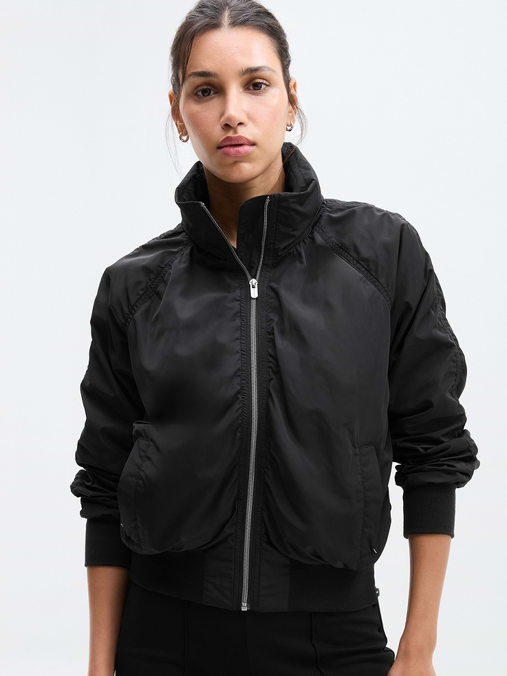 Image 1 of 7, FOR: Your workday commute and weekend travels, from meetings to meetups, FEEL: Recycled polyester fabrication is sleek with a soft hand-feel, FAVE: Stowable hood for changes in weather, Secure zip pockets to store your essentials, Side zipper detail allows for freedom of movement, Product #818839
