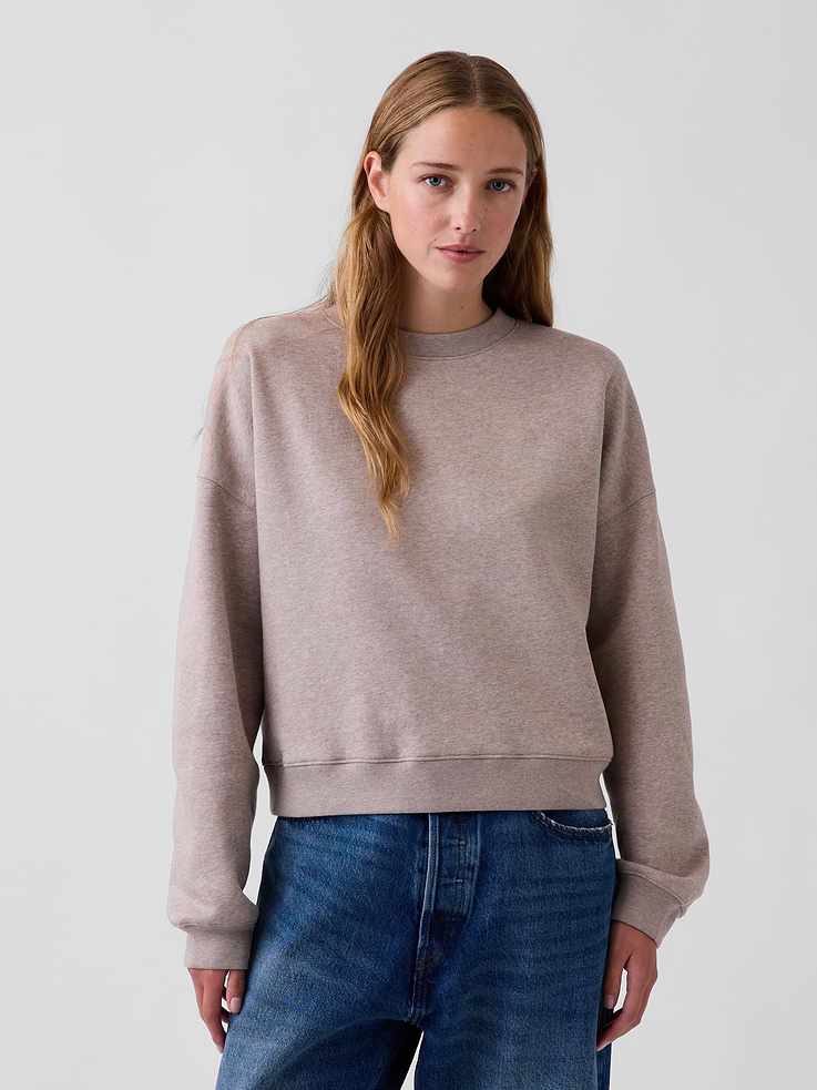 Image 1 of 6, Soft cotton-blend pullover sweatshirt. In a slightly cropped fit., Crewneck., Long sleeves with dropped shoulders and banded cuffs., Banded hem., Note: Sugar plum neon pink style requires separate care instructions. The dye used in the crafting of this product is prone to crocking, or color transfer. Please avoid contact with light-colored fabric or upholstery., Explore our GapSweats Guide ., Product #548299