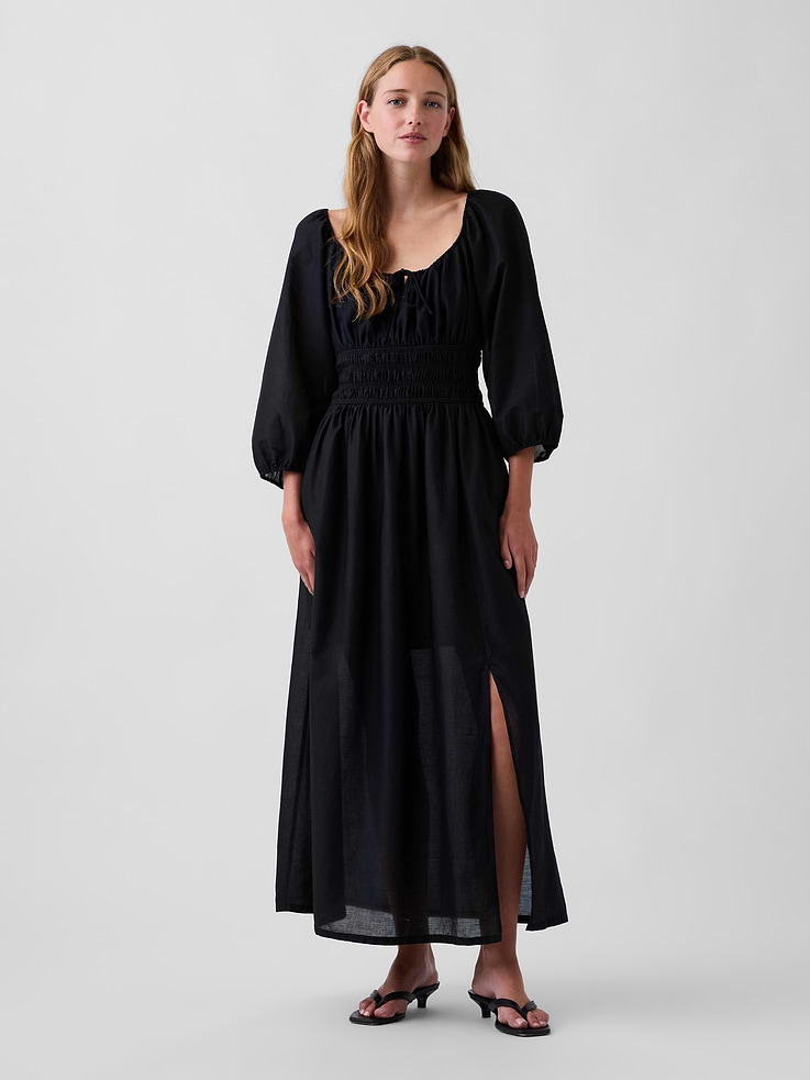 Image 1 of 5, Light, airy cotton voile maxi dress., Elasticized split neck with functional self-tie closure at front., Puffed 3/4 sleeves with elasticized cuffs., Smocked waist., Lined bodice and skirt., This product was made in a factory that invests in gender equity and women’s empowerment through RISE. Learn more at gapinc.com/equity ., Product #1189363