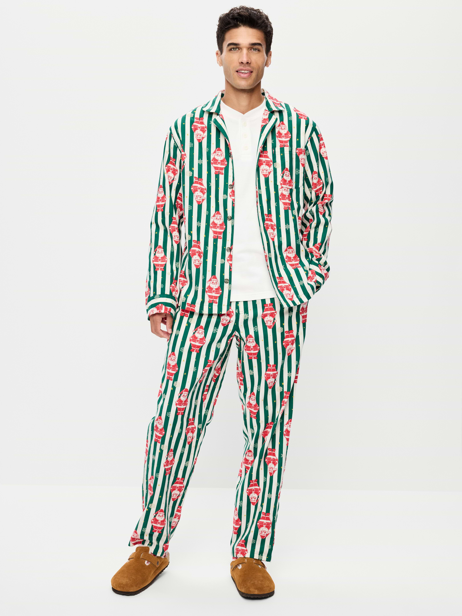 Image 1 of 3, set includes pajama shirt and matching pants, spread collar, long sleeves, button front, elastic-waist pajama pants, on-seam hip pockets, prints match back to the fam, Product #905023