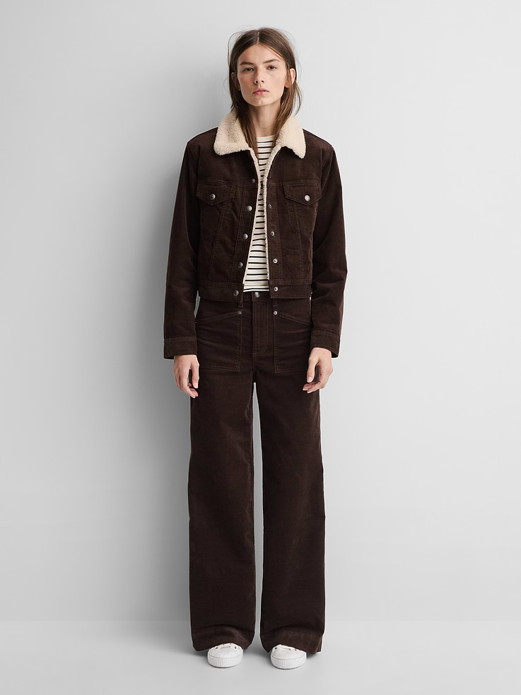 Image 1 of 9, Soft, stretch corduroy wide-leg pants., Logo button closure, zip fly., Logo button tabs at waistband., Slanted patch pockets at front, welt pockets at back., Gap × A.P.C. logo leather patch at back., Responsibly Made: This pant is part of our water-saving Washwell program. Compared with conventional wash methods, Washwell uses at least 20% less water., Product #1179760