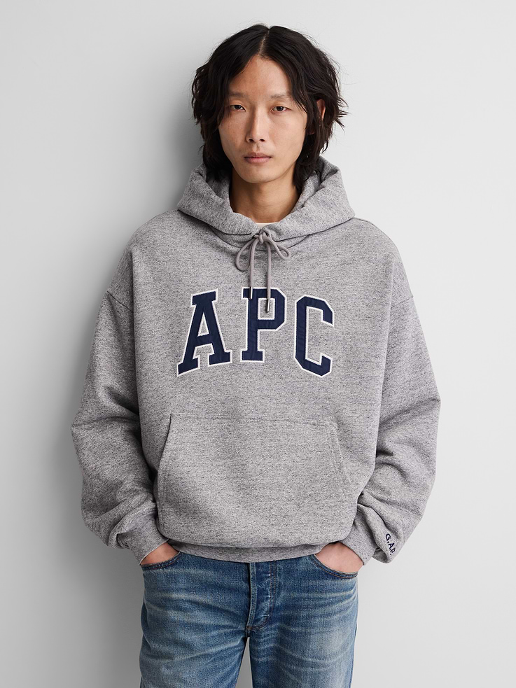 Image 1 of 9, Soft, extra heavyweight French terry hoodie. In an oversized fit., Hooded neckline with drawcords., Long sleeves with dropped shoulders., A.P.C. arch logo at front., Kanga pockets., Banded hem and cuffs., Made with 18% recycled polyester. Compared to virgin materials, using recycled materials helps reduce resource use and waste., Product #1179794