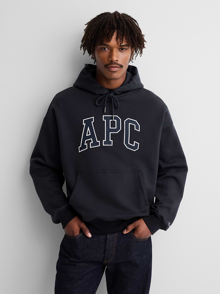 Image 1 of 8, Soft, extra heavyweight French terry hoodie. In an oversized fit., Hooded neckline with drawcords., Long sleeves with dropped shoulders., A.P.C. arch logo at front., Kanga pockets., Banded hem and cuffs., Made with 18% recycled polyester. Compared to virgin materials, using recycled materials helps reduce resource use and waste., Product #1179794