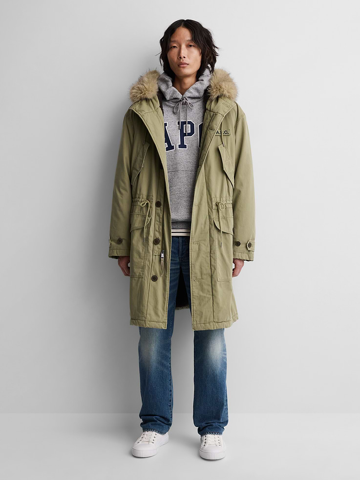 Image 1 of 10, Smooth canvas cotton parka jacket. In an oversized fit., Cozy sherpa lining., Hooded neckline with detachable vegan fur trim., Long sleeves., Hidden 2-way zipper at button front., Drawcords at waist., Pockets at front., Product #1179805