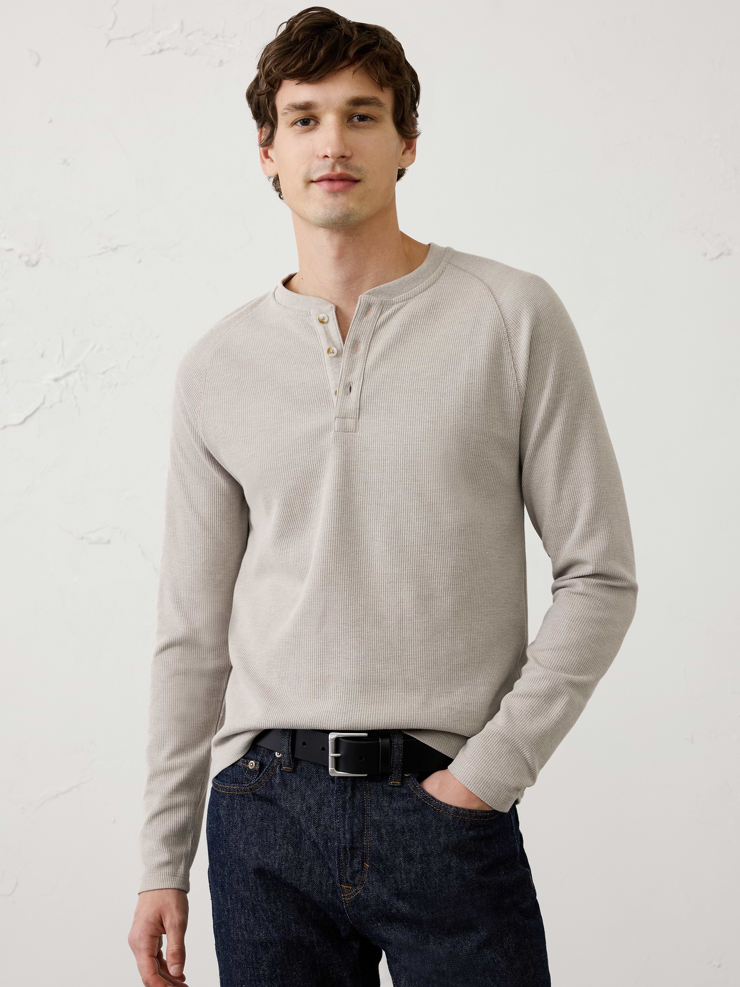 Image 1 of 3, We've updated our waffle fabric with a more traditional, heritage‑inspired waffle stitch and a cotton‑rich blend for enhanced comfort and timeless appeal. The richly textured knit offers breathable warmth and a substantial feel, making it an easy everyday layer that combines classic style with modern comfort., Three‑button henley collar. Long sleeves., Ribbed collar., Made exclusively for Banana Republic Factory., Product #1176081