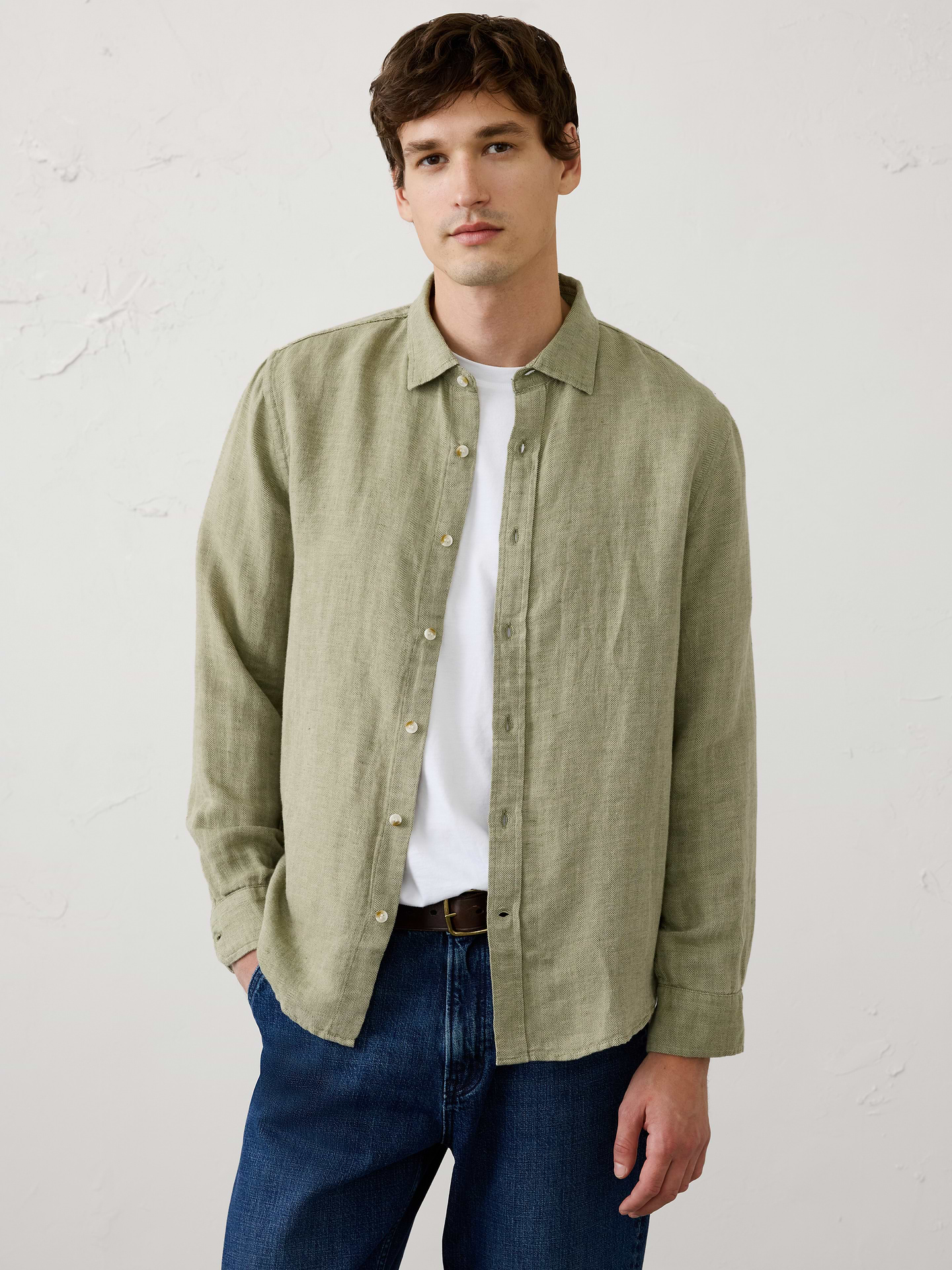 Image 1 of 3, Crafted from breathable linen-cotton blend, this shirt is elevated with a subtle herringbone weave that adds depth and texture. Designed in versatile colors, it delivers effortless warm‑weather style with a refined finish., Point collar. Long sleeves with adjustable double-button barrel cuffs and button vents., Button‑front closure., Back yoke., Shirttail hem., Made exclusively for Banana Republic Factory., Product #1175889