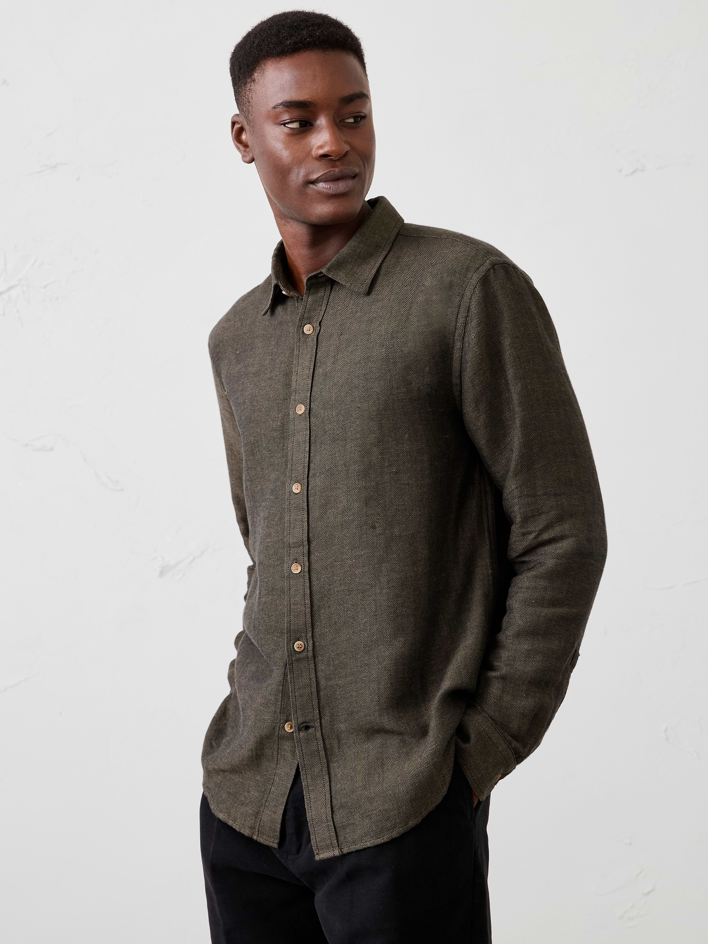 Image 1 of 7, Crafted from breathable linen-cotton blend, this shirt is elevated with a subtle herringbone weave that adds depth and texture. Designed in versatile colors, it delivers effortless warm‑weather style with a refined finish., Point collar. Long sleeves with adjustable double-button barrel cuffs and button vents., Button‑front closure., Back yoke., Shirttail hem., Made exclusively for Banana Republic Factory., Product #1175889