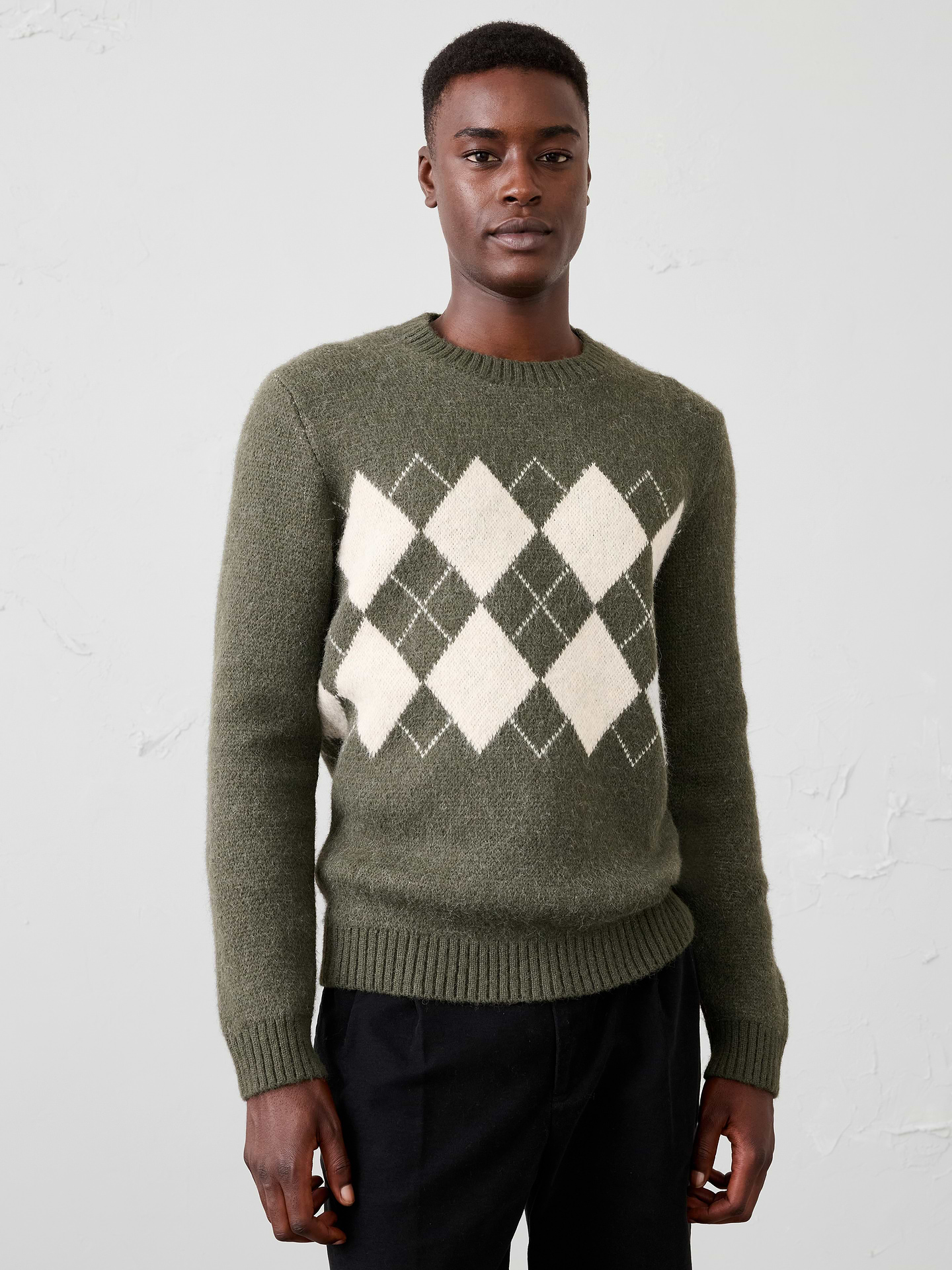Image 1 of 5, Designed in a soft, brushed hairy yarn, this modern argyle sweater brings texture and personality to a classic pattern. The plush finish adds warmth and dimension, while the standout design transitions effortlessly from polished workwear to more casual weekend looks., Crew neck. Long sleeves., Ribbed neckline, arm cuffs and hem., Made exclusively for Banana Republic Factory., Product #1177783
