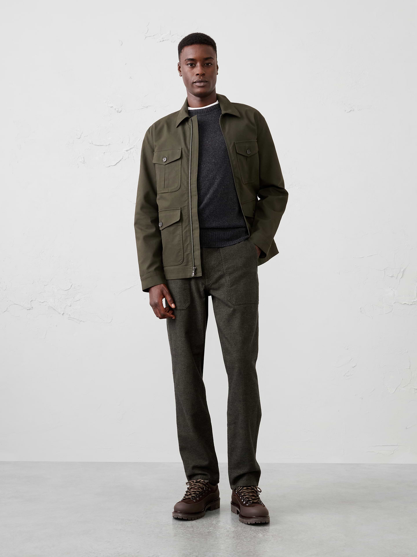 Image 1 of 7, Inspired by classic utility styling, this textured pant adds subtle visual depth while maintaining a soft, comfortable feel. Cut in our Athletic Fit with extra room through the hip and thigh, it combines functional details with versatile everyday wearability., Button closure with zip fly. Belt loops., Contrast trim at front pocket openings., Angled front patch pockets., Back patch pockets., Vertical front seam detailing., Made exclusively for Banana Republic Factory., Product #1179691