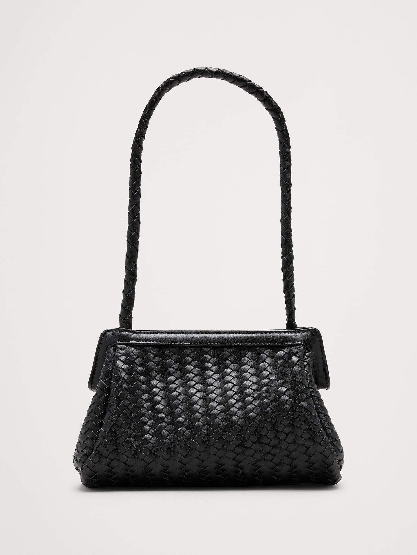 Image 1 of 8, The Nillie Bag goes with… well, just about everything. We love it's textured leather construction., Bembien: Beautiful, thoughtfully made accessories. Each Bembien piece is made by hand in small, considered batches using techniques passed down through generations., Magnetic closure., Open inner pocket., Product #1184018
