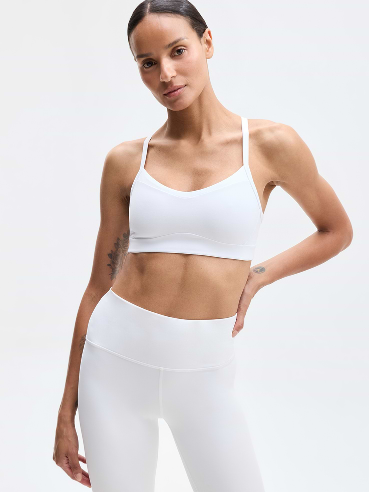 Image 1 of 5, BEST FOR STUDIO: yoga + barre + pilates, IMPACT: Light-impact workouts, best for A-C cups, FEEL: Powervita fabric is buttery soft with support that feels like a gentle hug, FAVE: Sleek racerback design provides distraction-free mobility and airflow, Built-in pockets with removable pads for optional coverage, Removable pads hold their shape from wash to wear, Lined with PowerMesh for breathable, sheer-proof coverage, Product #819515
