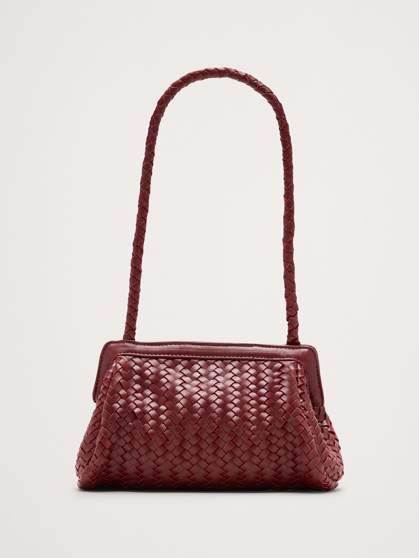 Image 1 of 8, The Nillie Bag goes with… well, just about everything. We love it's textured leather construction., Bembien: Beautiful, thoughtfully made accessories. Each Bembien piece is made by hand in small, considered batches using techniques passed down through generations., Magnetic closure., Open inner pocket., Product #1184018