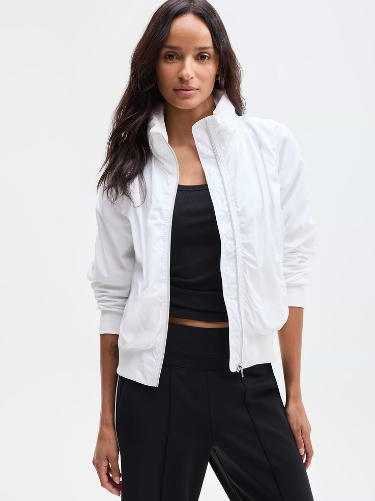 Image 1 of 8, FOR: Your workday commute and weekend travels, from meetings to meetups, FEEL: Recycled polyester fabrication is sleek with a soft hand-feel, FAVE: Stowable hood for changes in weather, Secure zip pockets to store your essentials, Side zipper detail allows for freedom of movement, Product #818839