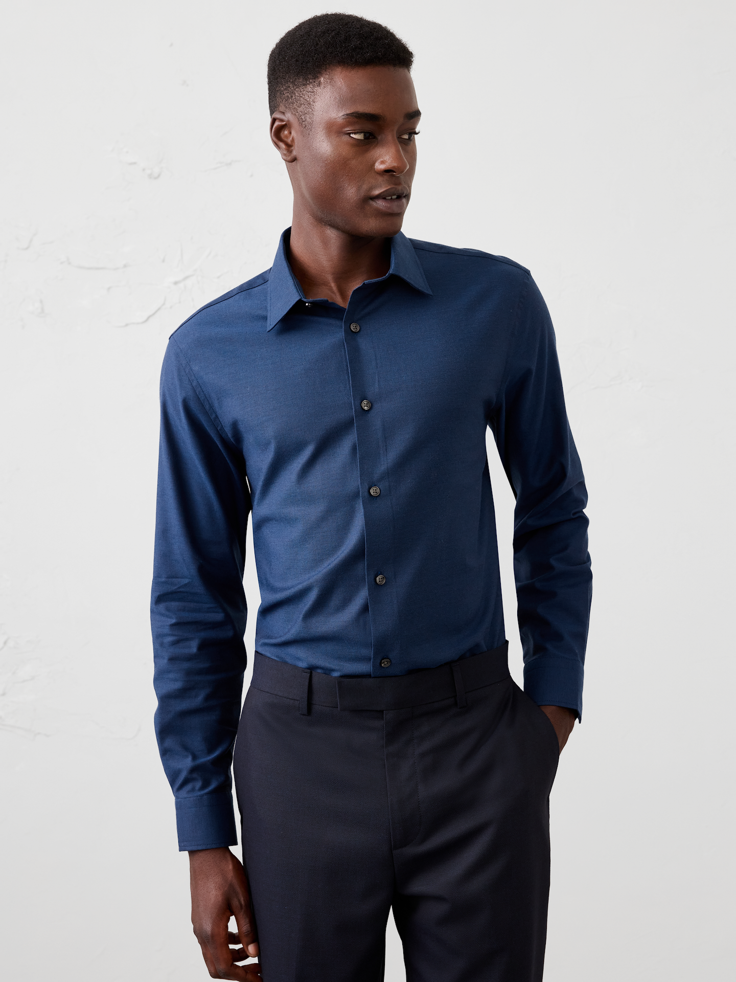 Image 1 of 8, WRINKLE RESISTANT: No need to iron, these soft, cotton dress shirts are specially engineered to resist wrinkles so it stays looking crisp and pulled-together., Spread collar. Long sleeves with adjustable double-button barrel cuffs and button vents., Clean front., Shirttail hem., Made exclusively for Banana Republic Factory., Product #1175945