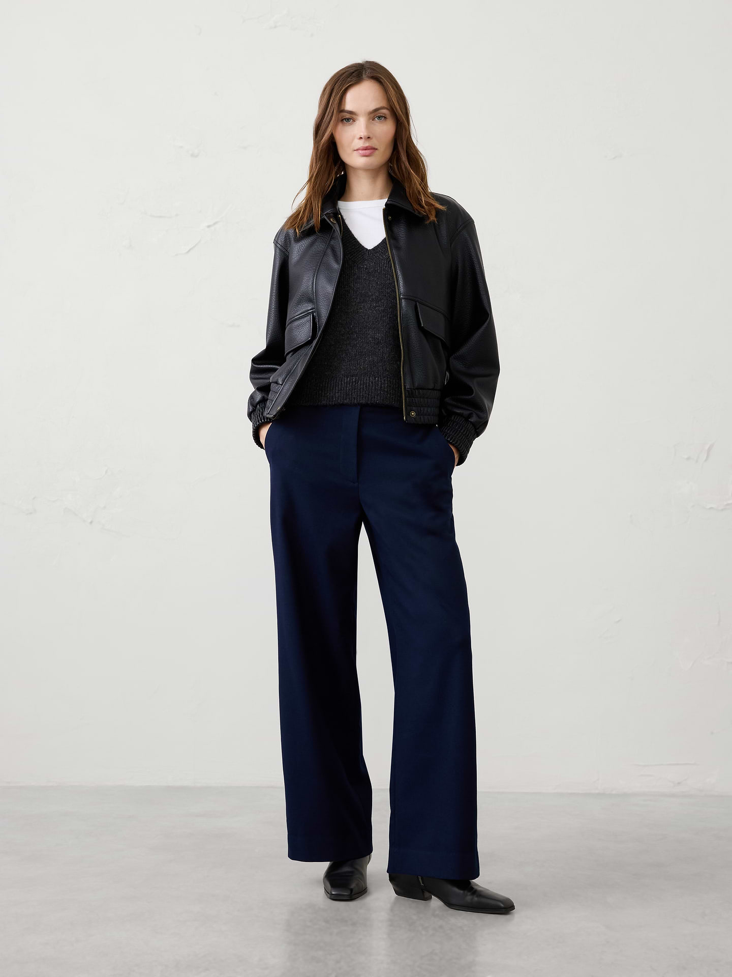 Image 1 of 8, Tailored sophistication meets cold-weather comfort in this wide-leg trouser. Crafted from a warm brushed flannel fabric, this elevated style is designed to keep you comfortable while looking polished throughout the season. Whether styled for the office, holiday gatherings, or special occasions, this versatile pant delivers effortless elegance from day to night., SUSTAINABILITY: Made with 68% recycled polyester., Classic fit. High rise. Wide leg. Full length., Hook-and-bar closure with zip fly. Belt loops., Front pleat detailing., Off-seam front pockets., Back welt pockets., Back waist darts., Made exclusively for Banana Republic Factory., Product #1182228