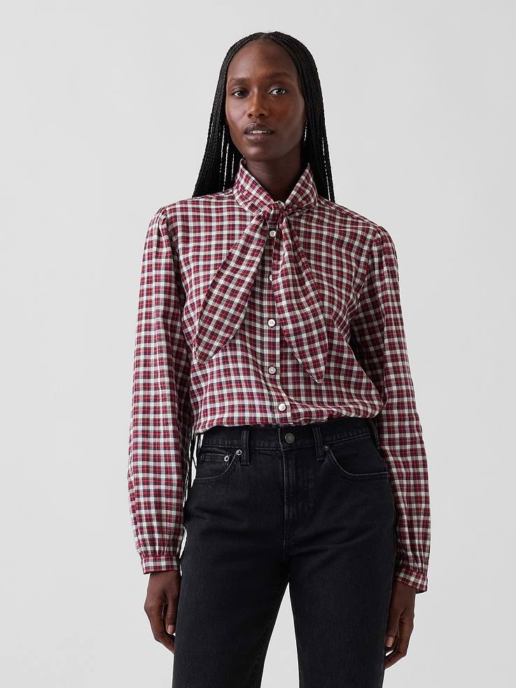Image 1 of 5, Soft, lightweight stretch cotton twill button-up shirt., Tie neck with band collar., Long sleeves with button cuffs., Button front., Shirttail hem., Allover plaid., This product was made in a factory that invests in gender equity and women’s empowerment through RISE. Learn more at gapinc.com/equity ., Product #1184321