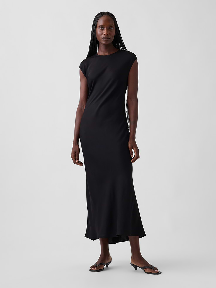 Image 1 of 5, Smooth rayon maxi slip dress., Round neck with loop button keyhole closure at back., Cap sleeves., Bias cut., This product was made in a factory that invests in gender equity and women’s empowerment through RISE. Learn more at gapinc.com/equity ., Product #1184721