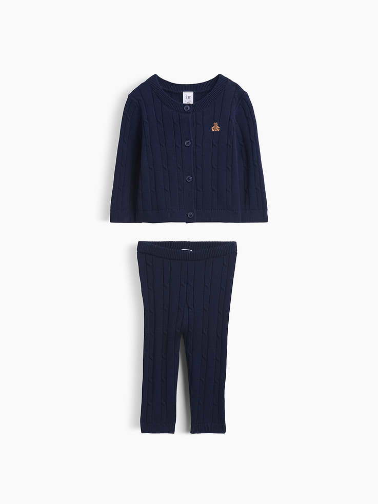 Image 1 of 3, Soft cable-knit cotton cardigan sweater and pull-on sweater pants outfit set., Crewneck, button front., Long sleeves., Embroidered Brannan Bear at chest., Elasticized waist at pants., Ribbed cuffs and hem., This product was made in a factory that invests in gender equity and women’s empowerment through RISE. Learn more at gapinc.com/equity ., Product #1185430