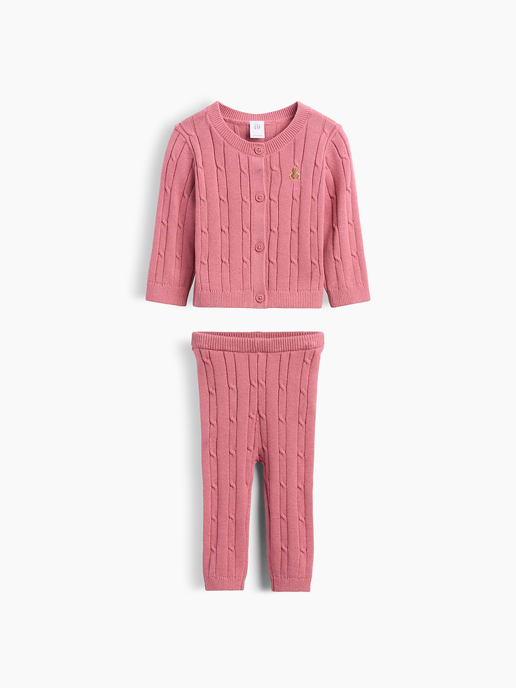 Image 1 of 3, Soft cable-knit cotton cardigan sweater and pull-on sweater pants outfit set., Crewneck, button front., Long sleeves., Embroidered Brannan Bear at chest., Elasticized waist at pants., Ribbed cuffs and hem., This product was made in a factory that invests in gender equity and women’s empowerment through RISE. Learn more at gapinc.com/equity ., Product #1185430
