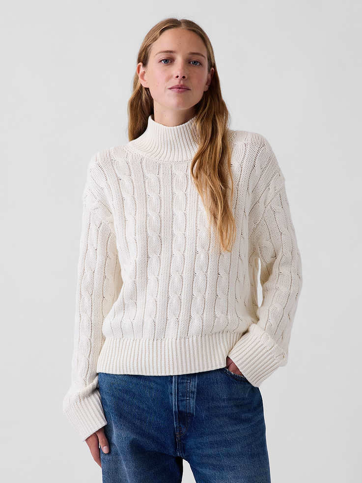 Image 1 of 5, Soft knit cotton sweater. In an oversized fit and slightly cropped length., Mockneck., Long sleeves with drop shoulders., Ribbed cuffs and hem., This product was made in a factory that invests in gender equity and women’s empowerment through RISE. Learn more at gapinc.com/equity ., Product #1186084