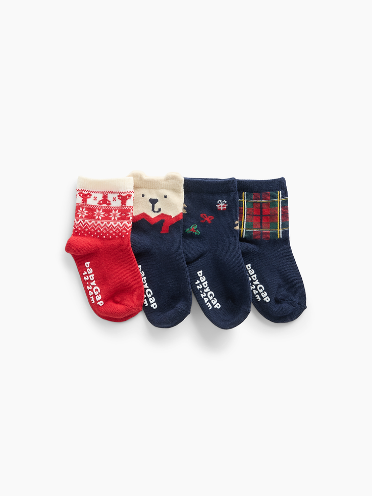 Image 1 of 2, Soft, stretch knit crew socks., Ribbed top., Reinforced toe and heel., Holiday prints at top., This product was made in a factory that invests in gender equity and women’s empowerment through RISE. Learn more at gapinc.com/equity ., Product #1185882