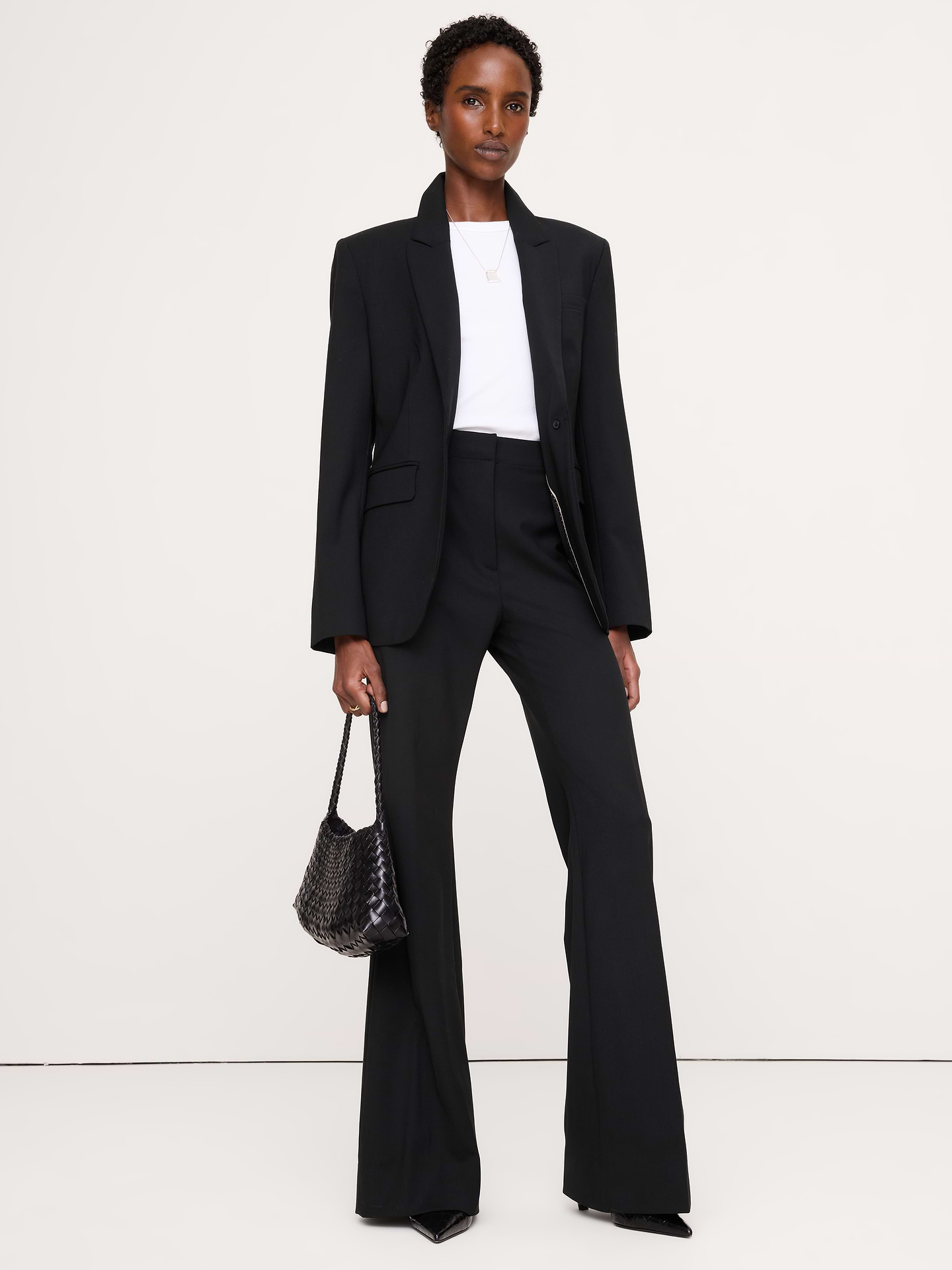 Image 1 of 8, We fell hard for our signature Siena lightweight wool for its all-season weight, subtle stretch, and Italian origins. Here, we cut a slim silhouette with an ultra high-rise and a flare leg. Breathable, Wrinkle-Resistant ., Ultra high-rise. Fitted through the hip and thigh with a flared leg. Full length., Fabric from Italy's Marzotto mill., Zip fly with hook-and-bar closure. Belt loops., Back pockets., Unlined., Product #826931