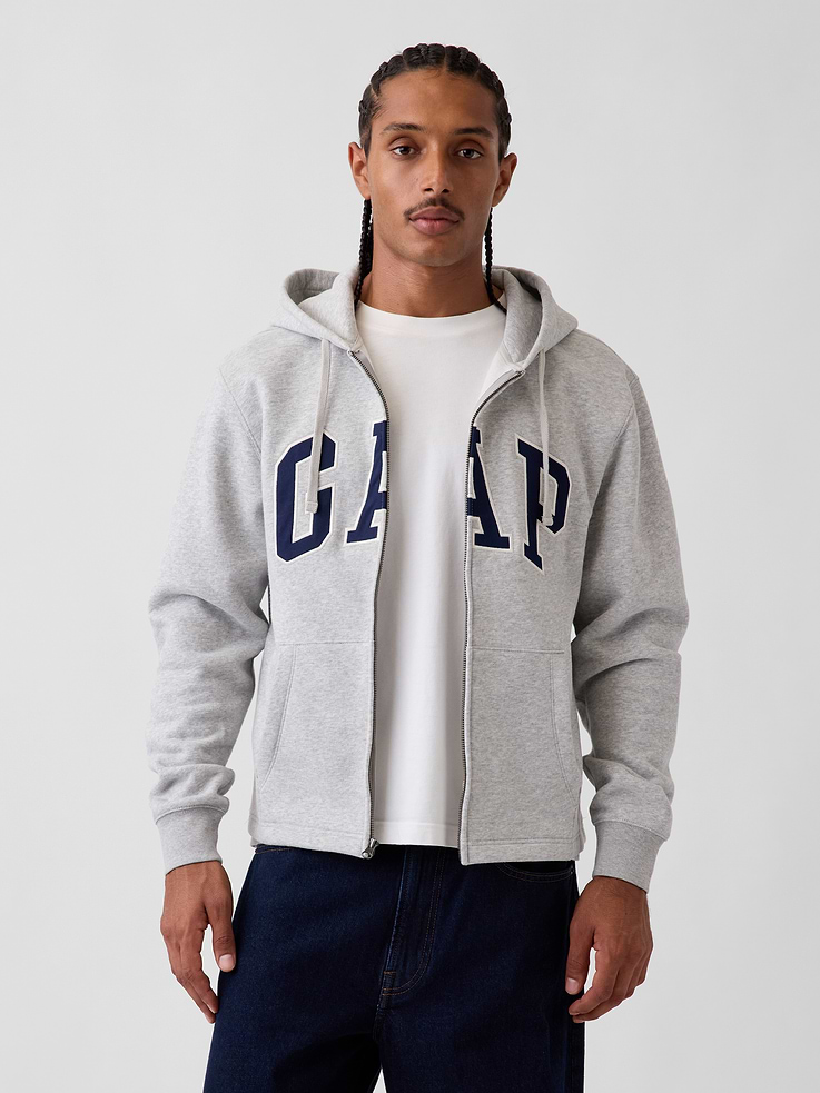 Image 1 of 5, Soft cotton-blend fleece full-zip hoodie. In a relaxed fit., Hooded neckline with drawcords., Long sleeves with drop shoulders and banded rib cuffs., Zipper front., Gap logo at front., Kanga pockets., Straight hem., Made with 52% Protocol cotton verified by the U.S. Cotton Trust Protocol, a program which works with farms committed to improving their environmental footprint by minimizing water usage and improving soil health (Claim No. 10127)., Made with 23% recycled polyester. Compared to virgin materials, using recycled materials helps reduce resource use and waste., This product was made in a factory that invests in gender equity and women’s empowerment through RISE. Learn more at gapinc.com/equity ., Product #1189438