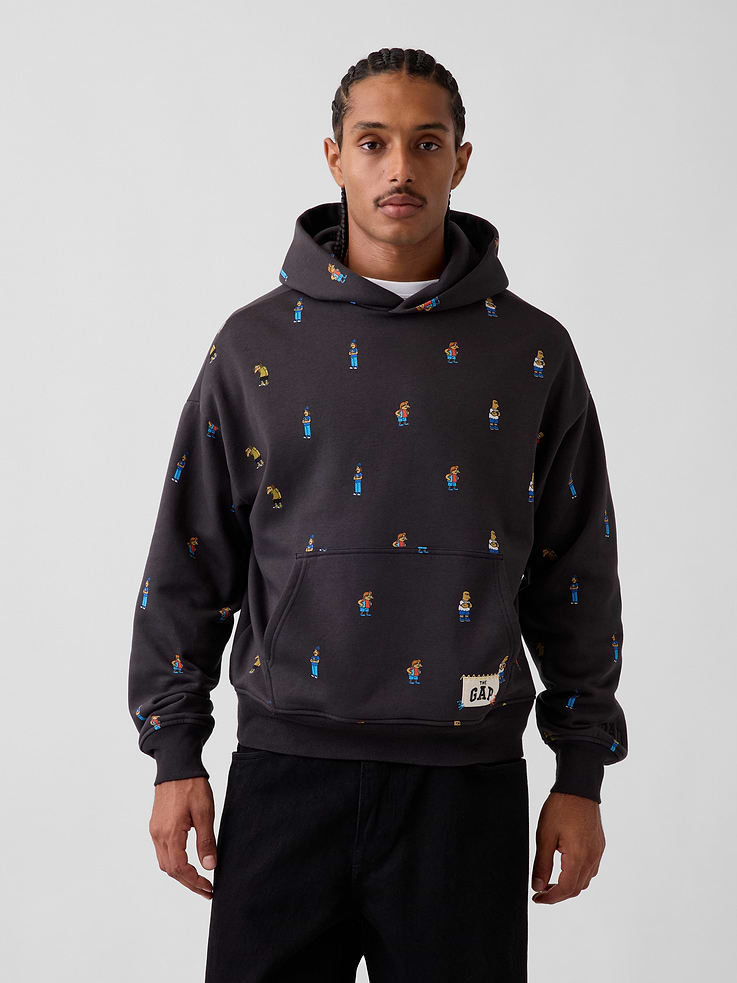 Image 1 of 8, Soft cotton-blend fleece hoodie. In an oversized fit., Hooded neckline., Long sleeves with dropped shoulders., Kanga pocket at front., Banded hem and cuffs., The Simpsons graphics., Made with 23% recycled polyester. Compared to virgin materials, using recycled materials helps reduce resource use and waste., Product #907426