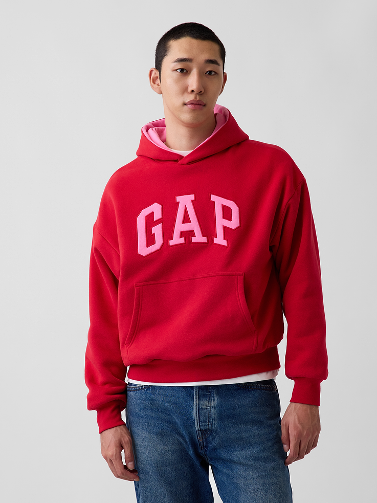 Image 1 of 9, Soft cotton-blend fleece pullover hoodie. In an oversized fit., Hooded neckline., Long sleeves with drop shoulders., Gap logo at front., Kanga pocket., Banded rib cuffs and hem., Reversible design., Made with 52% Protocol cotton verified by the U.S. Cotton Trust Protocol, a program which works with farms committed to improving their environmental footprint by minimizing water usage and improving soil health (Claim No. 10127)., Made with 23% recycled polyester. Compared to virgin materials, using recycled materials helps reduce resource use and waste., Product #1179752
