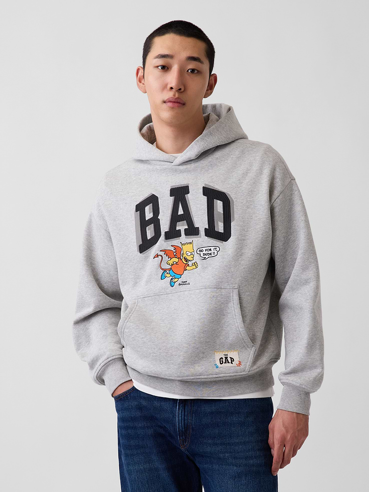 Image 1 of 9, Soft cotton-blend fleece hoodie. In an oversized fit., Hooded neckline., Long sleeves with dropped shoulders., Kanga pocket at front., Banded hem and cuffs., The Simpsons graphics., Made with 23% recycled polyester. Compared to virgin materials, using recycled materials helps reduce resource use and waste., Product #907426