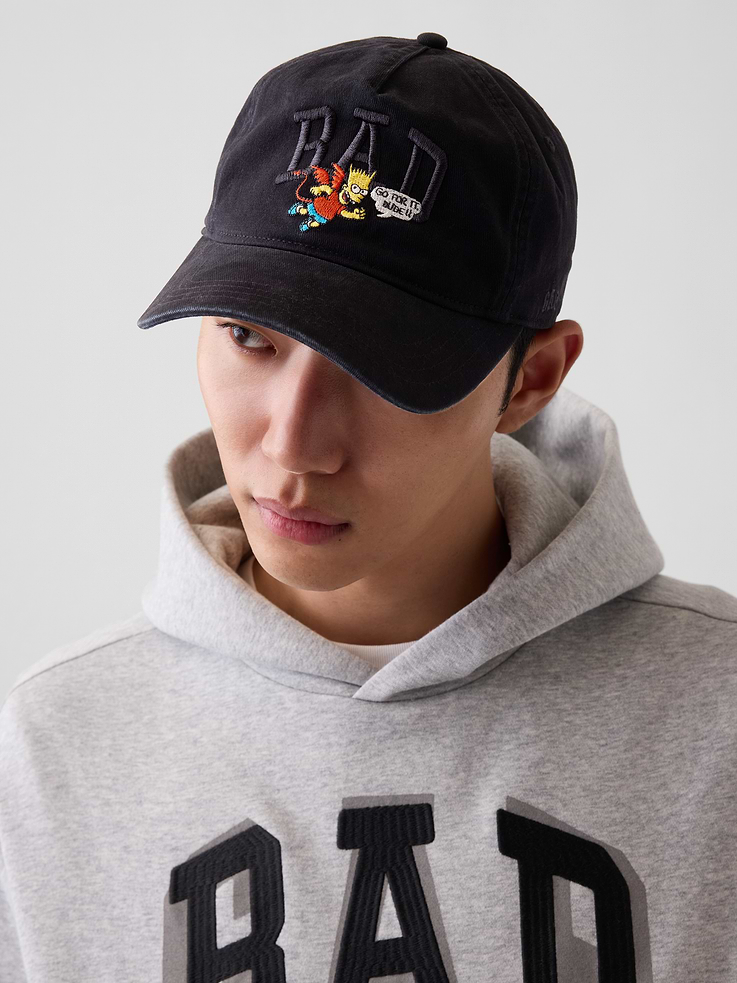 Image 1 of 5, Sturdy cotton baseball hat., Stitching at curved brim., Adjustable closure at back., Embroidered BAD logo and Bart Simpson at front., Product #907432