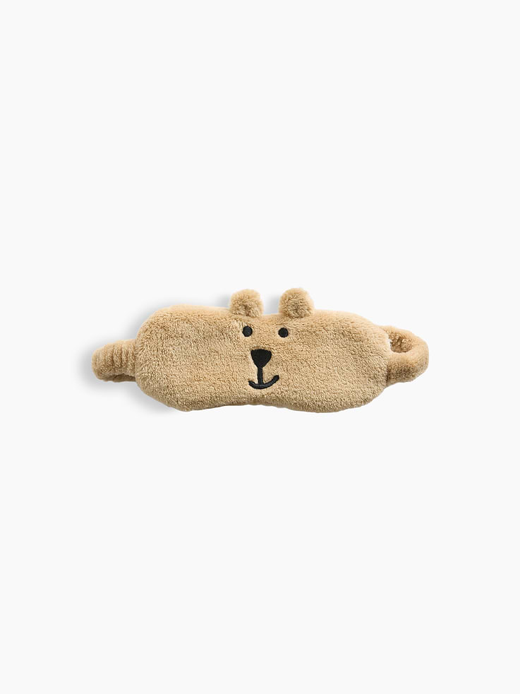 Image 1 of 2, Soft sherpa eye mask., Elasticized band., Brannan Bear ear appliques and embroidered face detail., This product was made in a factory that invests in gender equity and women’s empowerment through RISE. Learn more at gapinc.com/equity ., Product #1185937