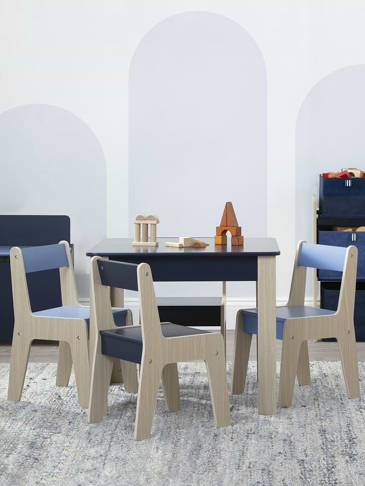 Image 1 of 4, Bring vibrant color and statement-making design to your child’s space with this GapKids by Delta Children Table and 4 Chairs Set., Well-crafted, this modern kids’ table and chair set features two-tone accents and a streamlined silhouette., More than just a good-looking option, this table and chair set includes a table with solid colored tabletop and four multi-colored chairs, so your child can enjoy activities with their siblings or friends., Constructed for some serious play, this kids table and chair set is sized just right for your growing child and is made from durable wood for long-lasting use., This product is Greenguard Gold certified to meet stringent chemical emissions standards., Recommended for ages 3 and older., Complete your child’s space by mixing, matching, and layering this table and chair set with other pieces from the GapKids by Delta Children Collection.