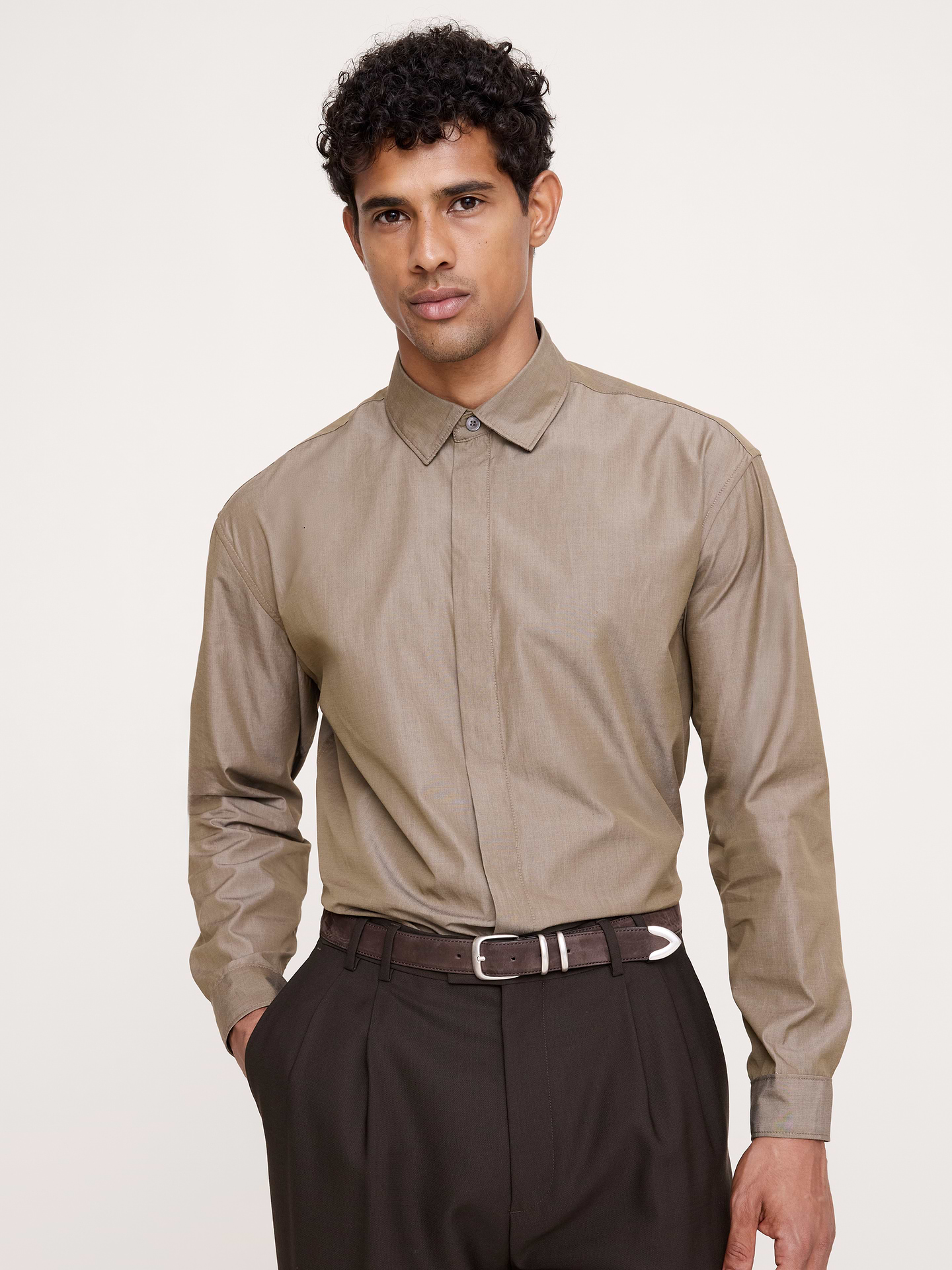 Image 1 of 2, A reflection of the past with details from today, this tuxedo dress shirt is made from incredibly soft poplin, set against a concealed placket for more streamlined style., Relaxed Fit: A straight & roomy fit with dropped shoulder seams., Point collar with concealed button closure., Shirttail hem., Product #1180027