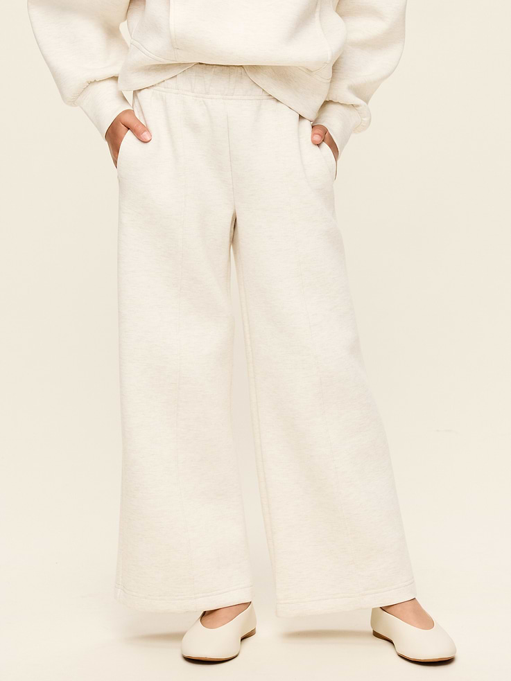Image 1 of 5, Keep ‘em moving in Old Navy Sport's Bounce Fleece: Our signature smooth spacer fabric that keeps its shape., elasticized waist, hip pockets, seamed front leg, pull-on style, wide leg, 4-way stretch, breathable, Product #907987