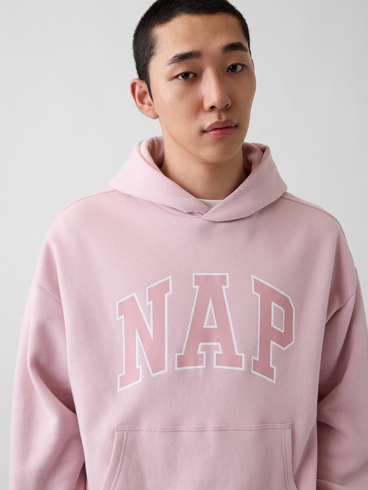 Image 1 of 3, Our softer than soft sweats. Brushed on the inside. Smooth on the outside. Made so that no two are alike., Soft cotton-blend fleece pullover hoodie. In an oversized fit., Hooded neckline.Long sleeves with drop shoulders., NAP arch logo at front., Kanga pocket., Banded cuffs & hem., Made with 23% recycled polyester. Compared to virgin materials, using recycled materials helps reduce resource use and waste., Explore our GapSweats Guide ., This product was made in a factory that invests in gender equity and women’s empowerment through RISE. Learn more at gapinc.com/equity ., Product #898155