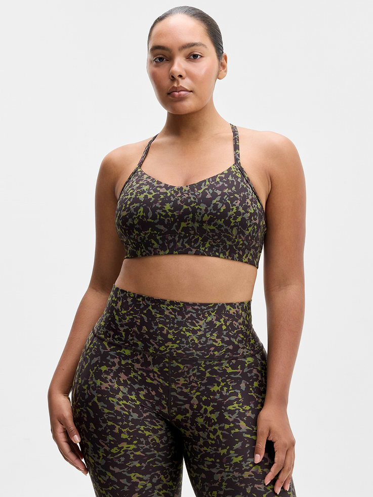 Image 1 of 4, BEST FOR STUDIO: yoga + barre + pilates, IMPACT: Light-impact workouts, best for A-C cups, FEEL: Powervita fabric is buttery soft with support that feels like a gentle hug, FAVE: Sleek racerback design provides distraction-free mobility and airflow, Built-in pockets with removable pads for optional coverage, Removable pads hold their shape from wash to wear, Lined with PowerMesh for breathable, sheer-proof coverage, Product #862214