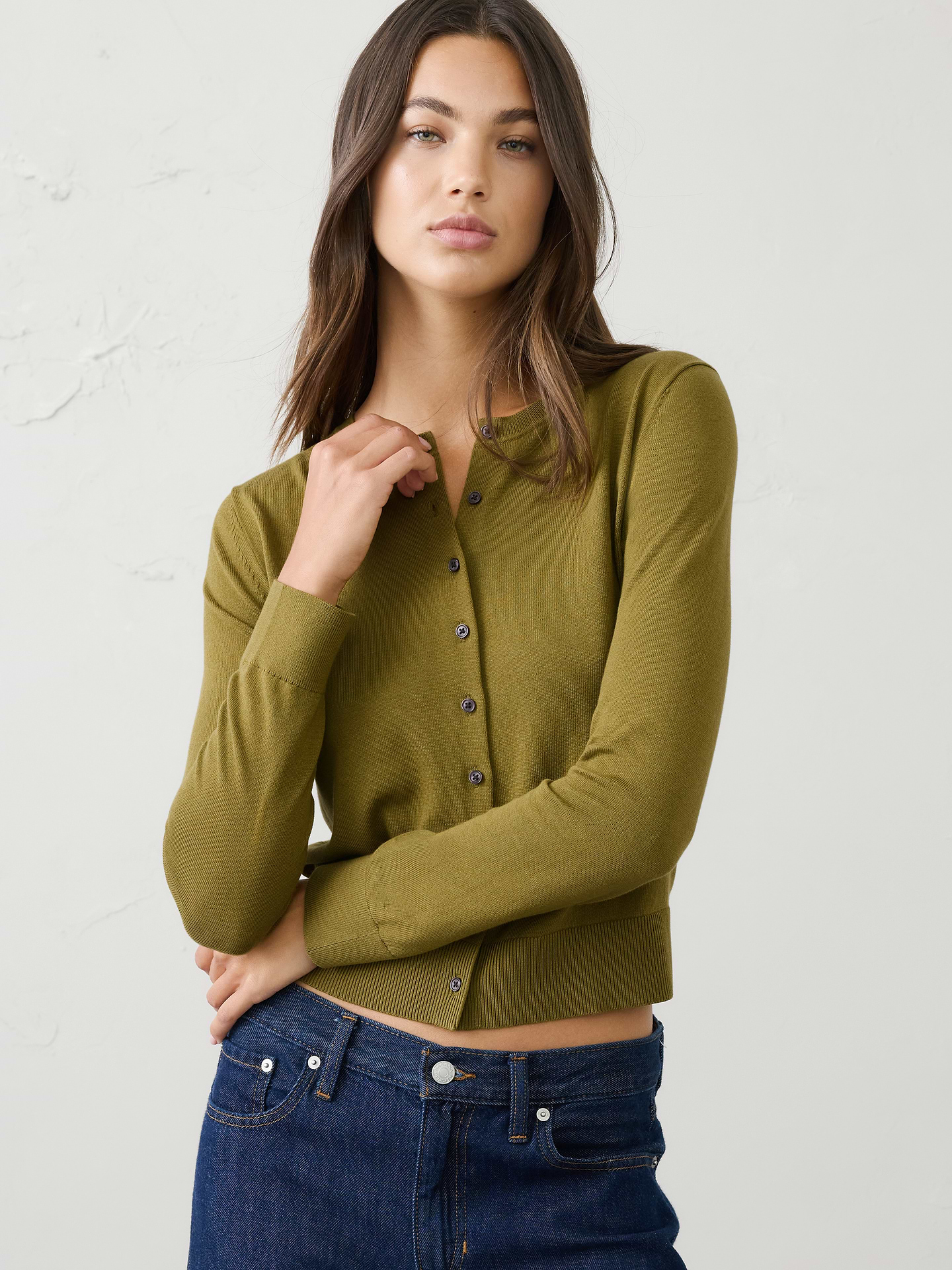 Image 1 of 8, Thoughtfully made with 40% Livaeco™ Viscose, produced from sustainable sourced renewable raw material and manufactured using closed-loop process that use up to 60% less water as compared to generic viscose., Lightweight fine gauge knit—perfect for layering or lounging., Crew neck. Long sleeves., Button front closure., Ribbed neck, arm cuffs and hem., Straight hem., Made exclusively for Banana Republic Factory., Product #1173402