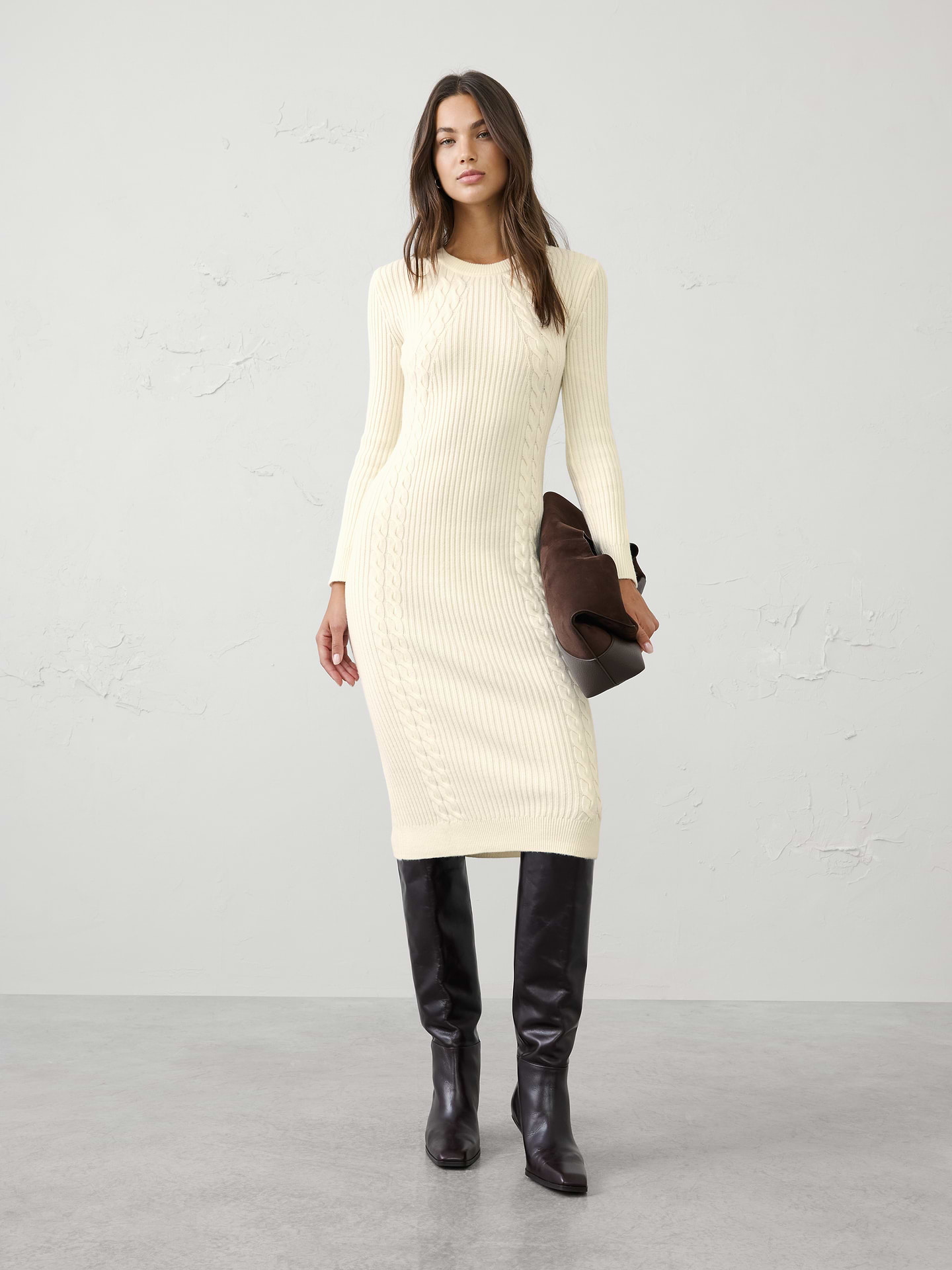Image 1 of 6, A modern cable knit brings rich texture and cozy warmth to this effortlessly elevated midi dress. Designed with a flattering silhouette and timeless appeal, it offers the perfect balance of comfort and polish for cooler days., Crew neck. Long sleeves., Ribbed neck, arm cuffs and hem., Cable knit detailing., Made exclusively for Banana Republic Factory., Product #1176481